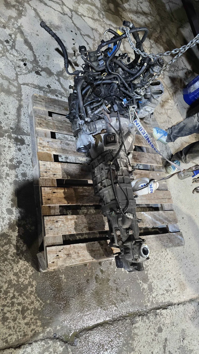 Engine and transmission assembly on a wooden pallet