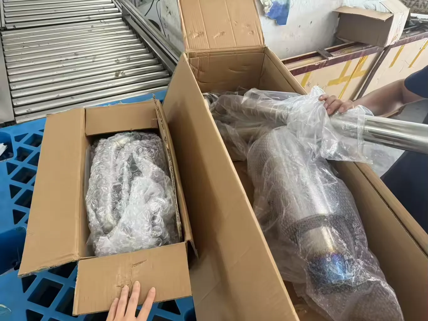 Exhaust components packed in boxes for shipping